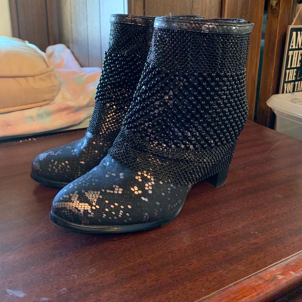 Black and silver heeled boots.
